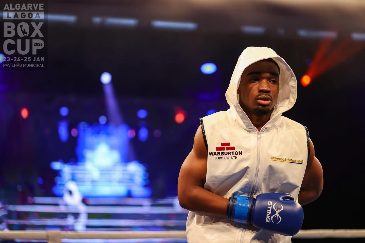 Emmanuel Appiah ringside at the Algarve Box Cup in a Warburton Services vest